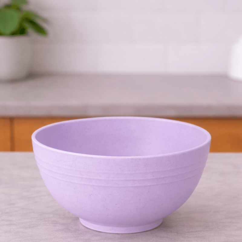 Purple wheat straw cereal bowl on a neutral background