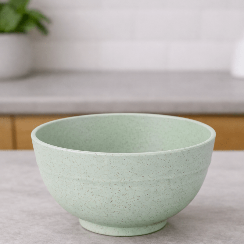 light green wheat straw cereal bowl on a neutral background