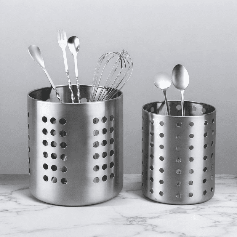utensil holder on a ciramic countertop holding kitchen tools