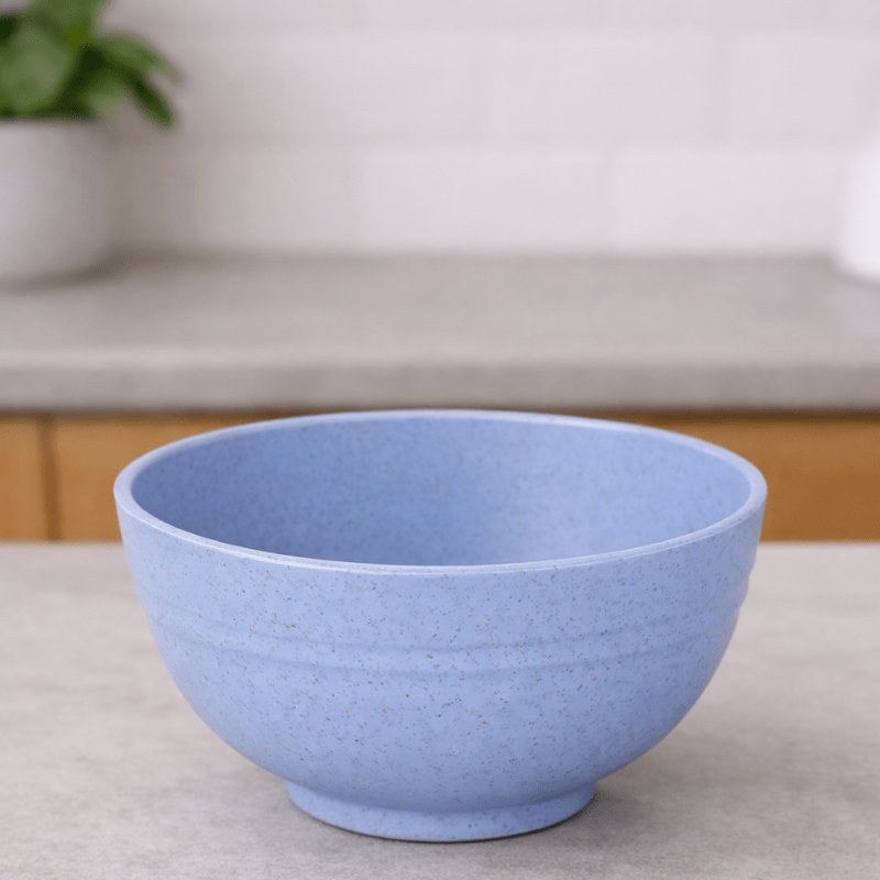 Light blue wheat straw cereal bowl on a neutral background